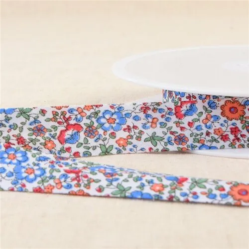 Bobine 25m biais fleurs bleu roy 20mm